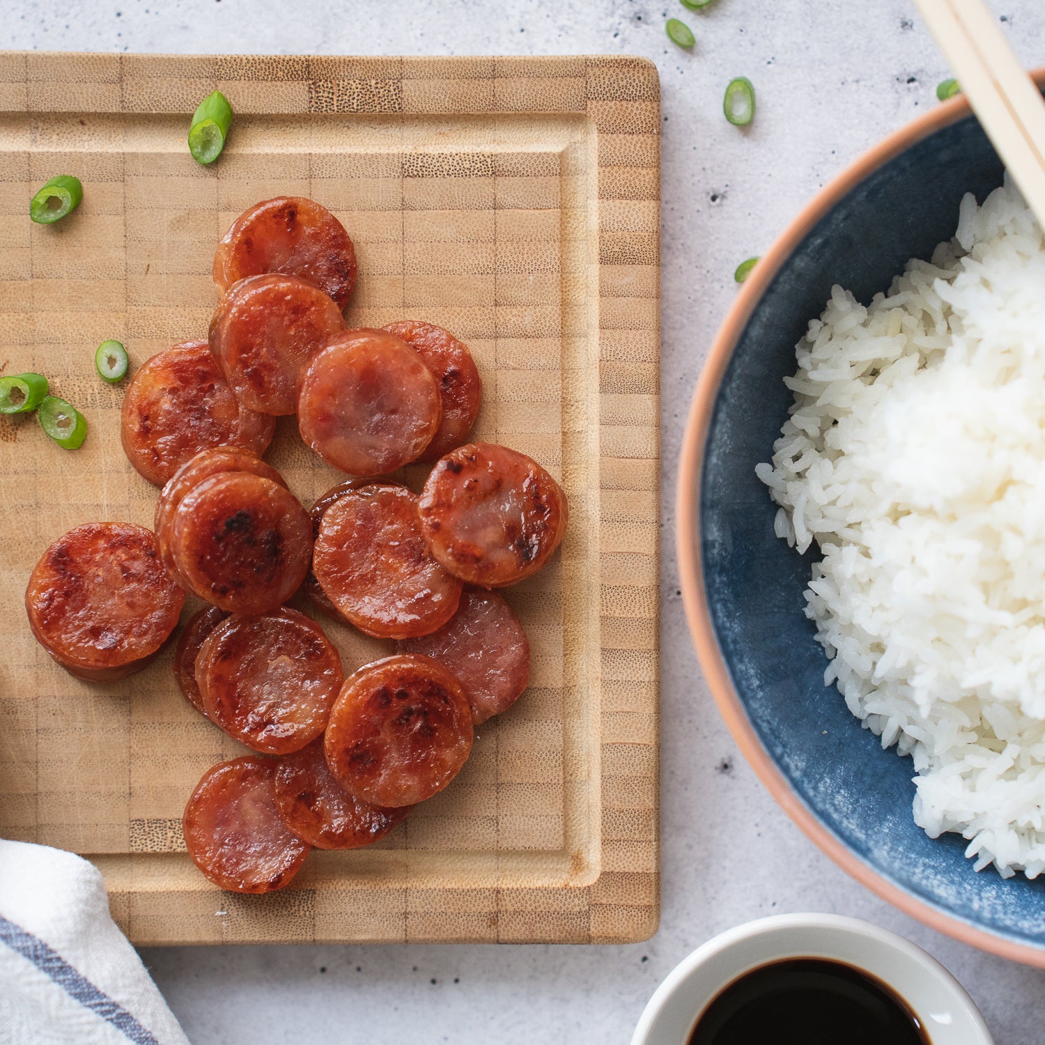 sliced up quang tran chinese sausages on a cutting board